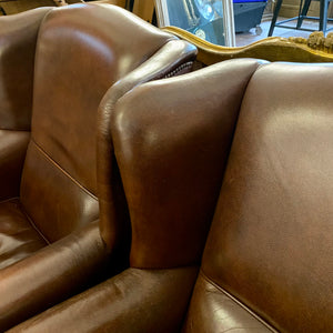 A pair of Dark Leather armchairs