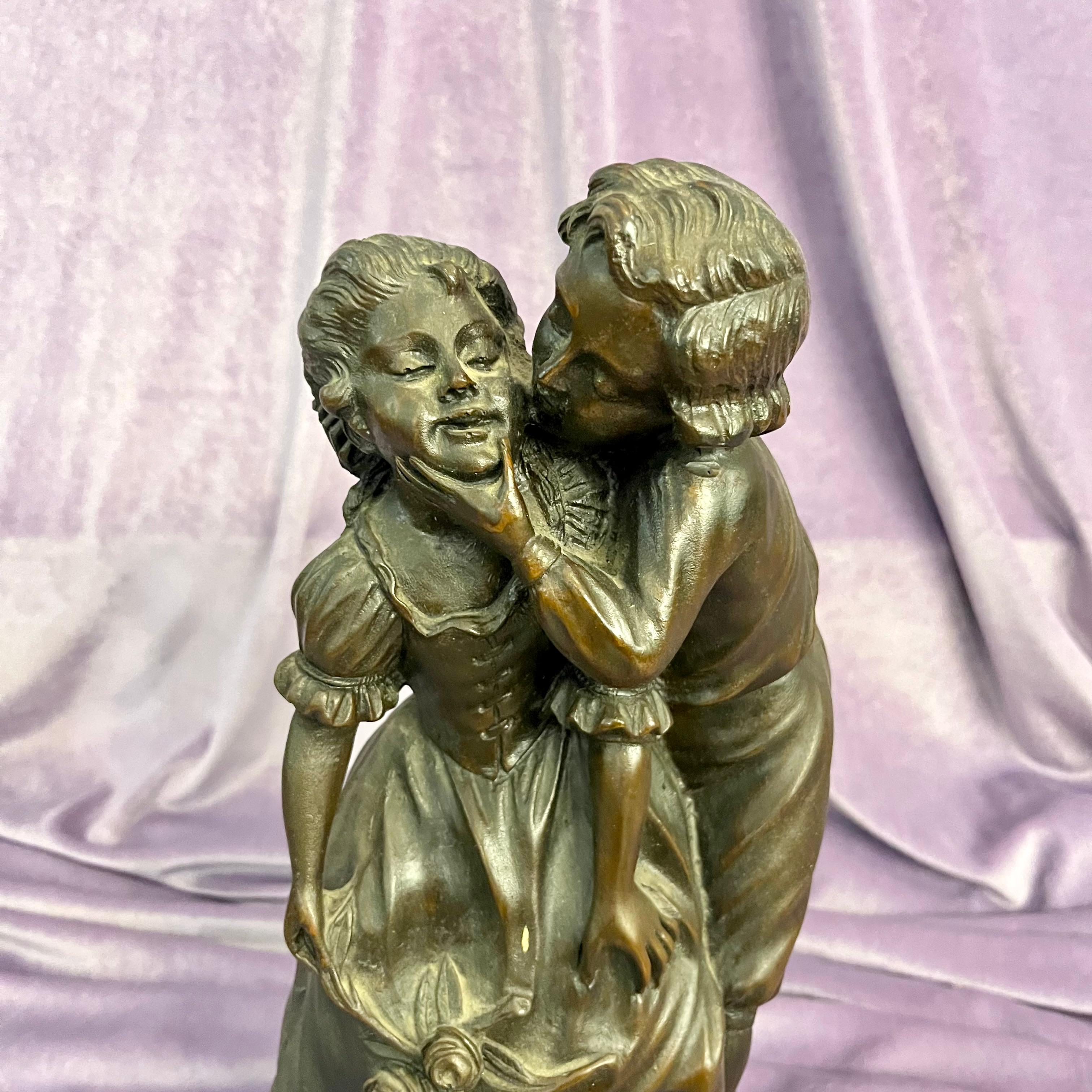 Antique Cast Statuette of Boy Kissing Girl