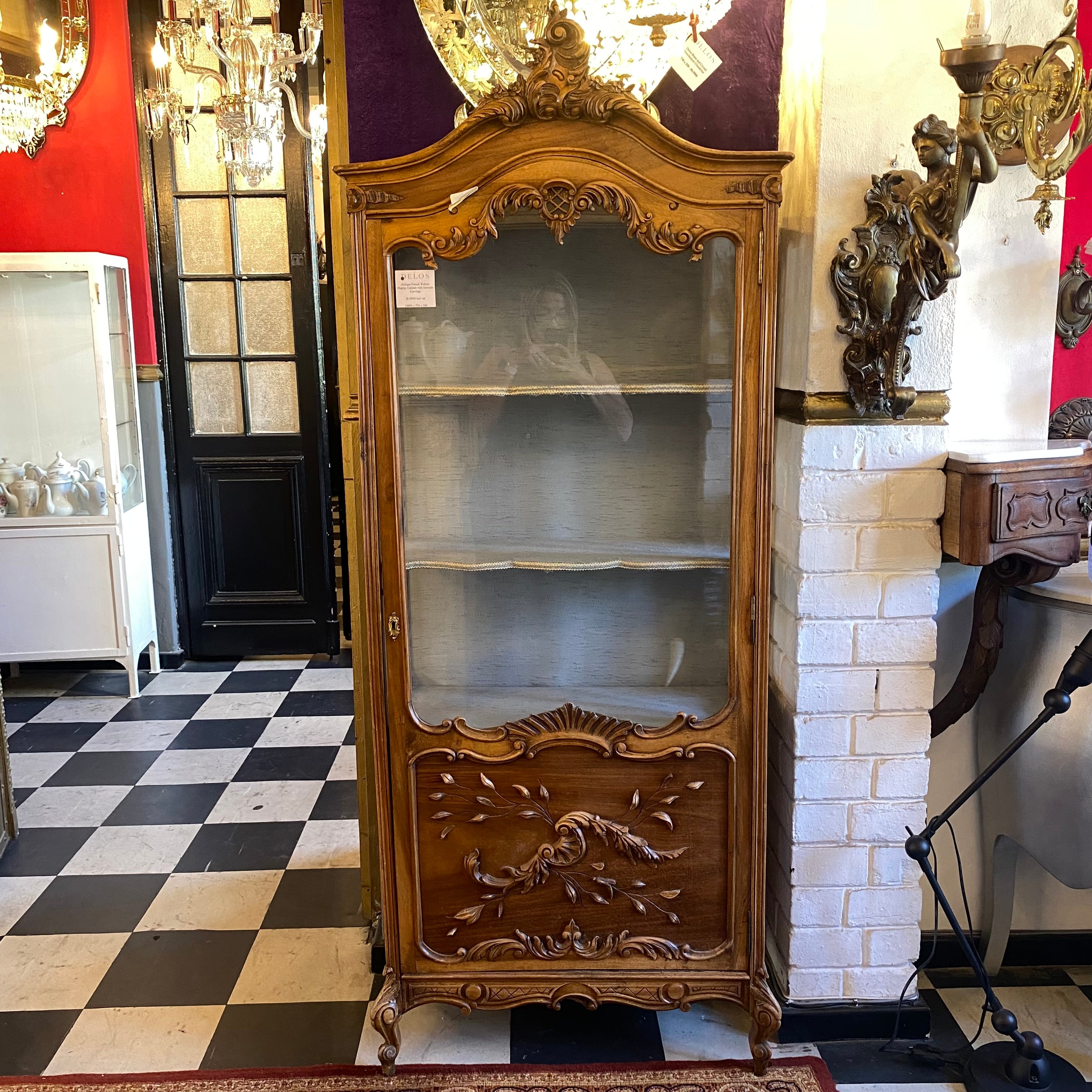 Antique French Walnut Display Cabinet with Intricate Carvings