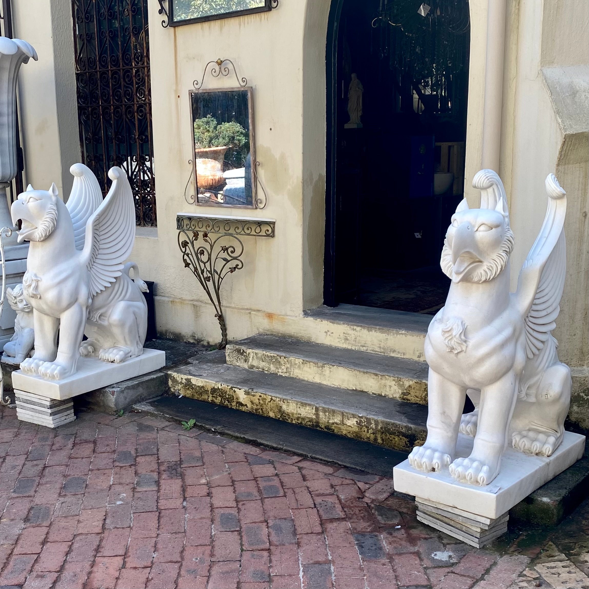 Pair of Carved White Marble Gryphons