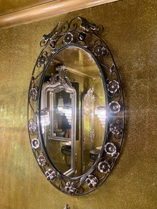 A Wrought Iron Mirror with Silver Detailing
