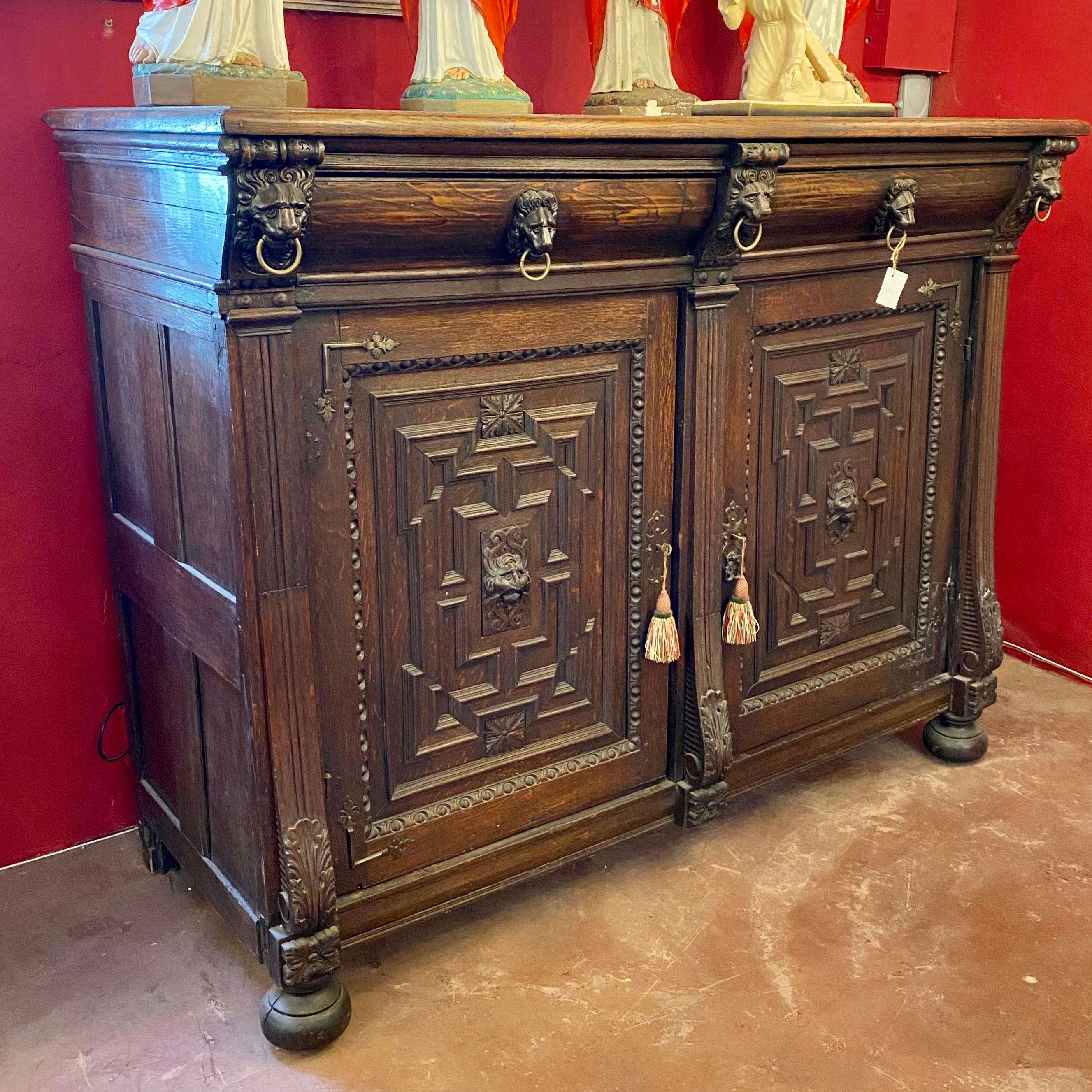 Antique French Oak Cabinet with Lion's Face Details